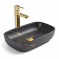 Black marble countertop basin with gold faucet and modern design 50 x 35 x 15cm